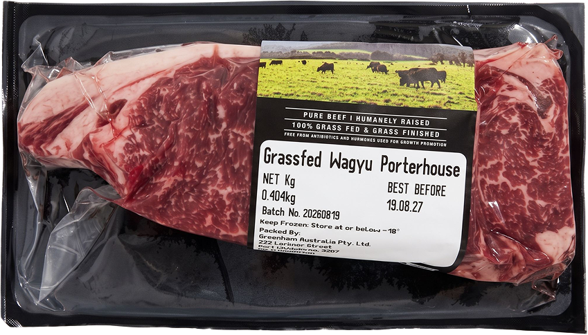 The real vacuum-sealed pack, labelled Grassfed Wagyu Porterhouse, 100% grass fed and grass finished, pure beef, humanely raised, free from antibiotics and hormones used for growth promotion
